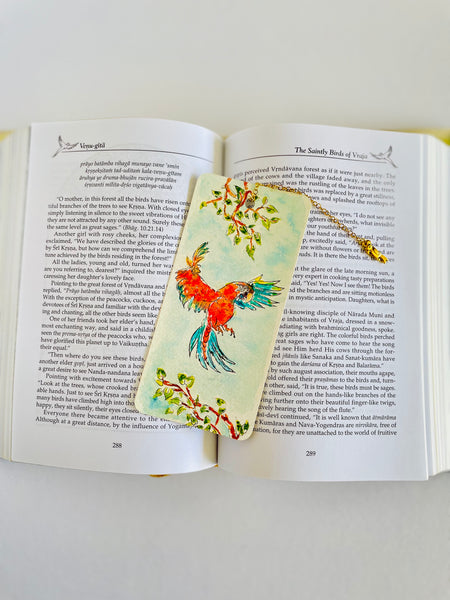 Gm.nitai parrot bookmark in an open book